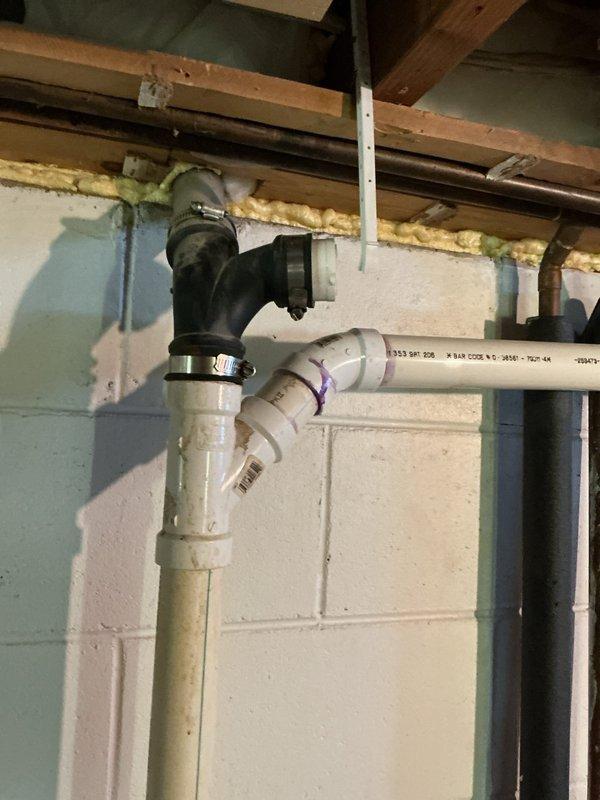 Successfully cleared a severe kitchen sink clog that was causing slow drainage and backup beyond the P-trap. Performed mechanical snaking of the drain line to remove accumulated black sludge that had been backing up through the dishwasher drain pipe. Inspected basement plumbing connections to ensure proper drainage flow was restored throughout the system.