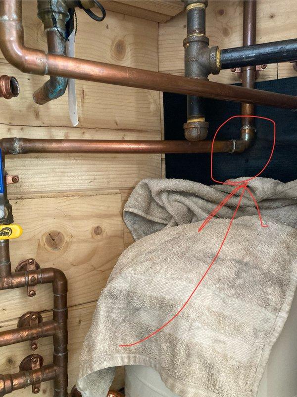 Repaired 3/4" copper cold water line in utility room of tiny home that had frozen and burst. This was the second occurrence in the same general area, with current failure approximately one foot from previous repair. Replaced damaged section of pipe and verified proper operation of the plumbing system.