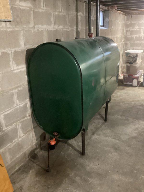 Responded to complaint of oil odor when furnace activates. Diagnosed misfiring oil furnace with rough ignition and excessive startup noise. Serviced unit by replacing nozzle, inspecting heat exchanger, and adjusting air setting from 6 to 10, which significantly improved flame quality and should resolve the odor issue.