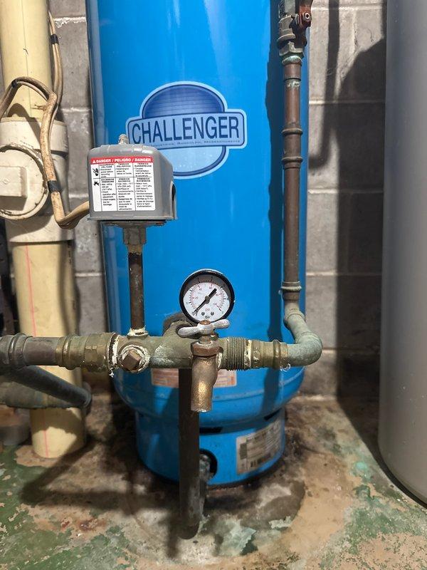 Responded to service call for complete loss of water pressure. Investigated Red Jacket pump system and Challenger pressure tank showing zero pressure despite power. Conducted electrical diagnostics including ohm testing of pump components. Due to specialized well system requirements, referred customer to Pelky plumbing for further service.