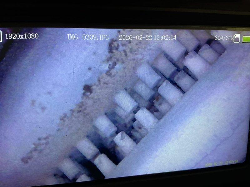 Responded to service call for 40+ year old boiler with no heat to basement zone baseboards. Diagnosed air-locked bottom floor zone and observed evidence of water leakage from the heat exchanger on the bottom block. Performed system maintenance by draining, filling, and purging baseboard zones in basement, successfully restoring heat to the affected areas, though noted the boiler has no repair option for the heat exchanger leak.