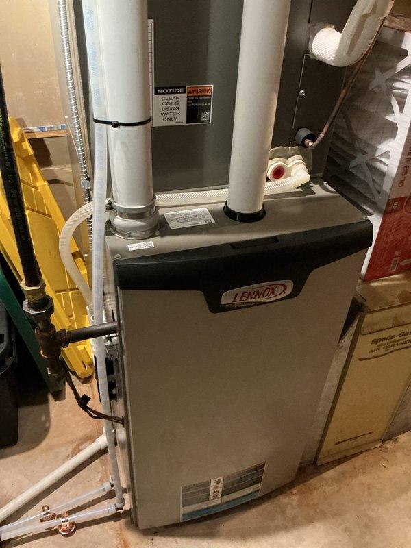 Diagnosed and repaired a pinhole leak in copper water supply line serving the dishwasher. Replaced damaged section of copper pipe with PEX tubing, reconnected the system, and performed leak test to confirm proper operation. Water service was restored with no further leakage observed in the basement ceiling area.