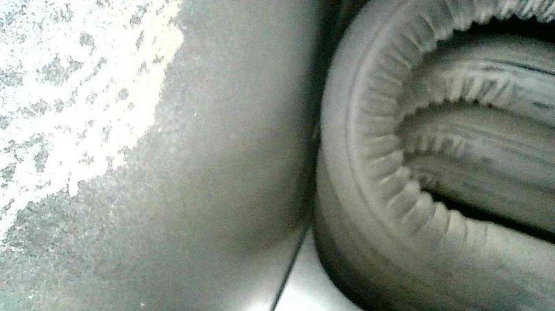 Performed comprehensive maintenance on two furnaces: newer Lennox unit (4-5 years old) and older Evcon model (20 years old). On the Lennox, reattached disconnected water exhaust pipe using PVC cement for permanent connection. For the Evcon furnace, replaced cracked drain hose and broken barbed fitting with new 3/8" vinyl tubing, secured with silicone sealant. Both units were tested and confirmed to be operating within specifications.