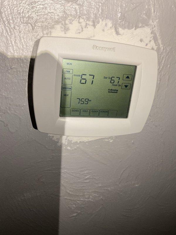 Responded to service call for intermittent heating issue with 10-year-old heat pump system. Diagnosed multiple issues including: plugged 5-inch filter due to ultrasonic humidifier usage, inducer motor operating loudly and out of specification, partially stripped collector box screw, incorrect exterior terminations, and unglued PVCT2 inducer fern coal. Observed primary heat exchanger overheating and system cycling (30-60 seconds) with occasional banging noises during startup/shutdown. Provided repair quote for inducer and collector box replacement.