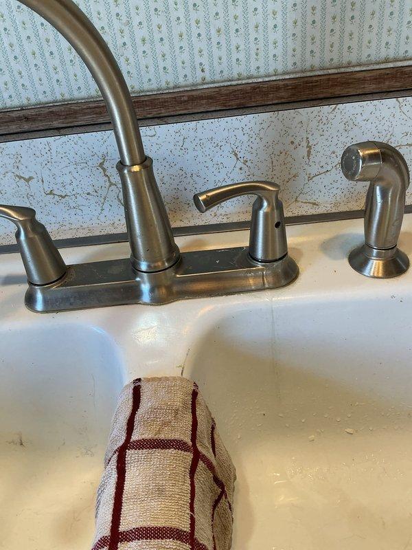 Responded to service call for kitchen faucet leaking from handle area. Diagnosed broken cartridge causing water to leak from handle and preventing proper shut-off. Replaced defective cartridge and verified repair with leak check, restoring proper faucet function.