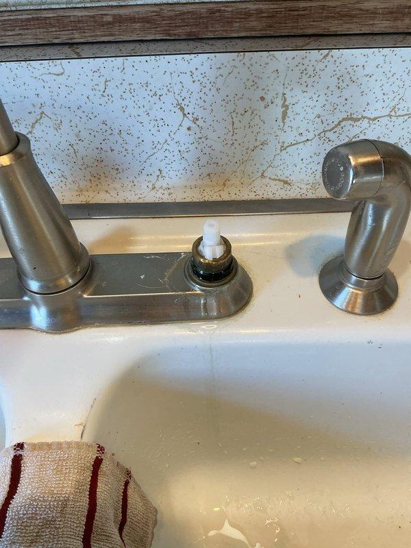 Responded to service call for kitchen faucet leaking from handle area. Diagnosed broken cartridge causing water to leak from handle and preventing proper shut-off. Replaced defective cartridge and verified repair with leak check, restoring proper faucet function.