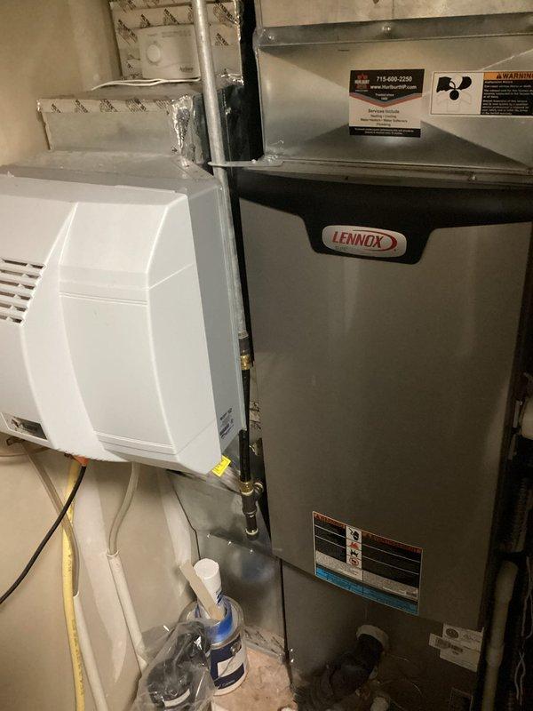 Investigated customer-reported intermittent gravelly noise primarily audible upstairs while furnace was operating normally. Inspection revealed a heavily soiled furnace filter which was replaced, and identified the humidifier as producing fan noise with a pad requiring replacement. System operation was verified after filter replacement, with recommendations to monitor for noise recurrence. Scheduled follow-up water heater inspection.