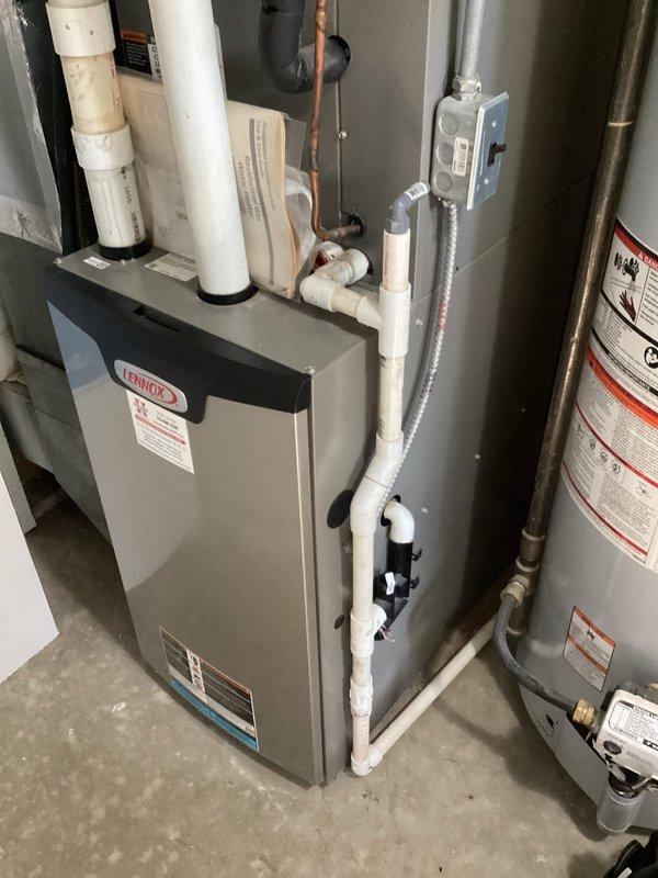 Completed warranty replacement of blower wheel and motor mount on Lennox furnace that was producing a howling noise. Installed and secured new components, then verified proper operation through startup testing including second stage heating cycle. Unit is now operating quietly and providing proper heating function with no abnormal sounds.