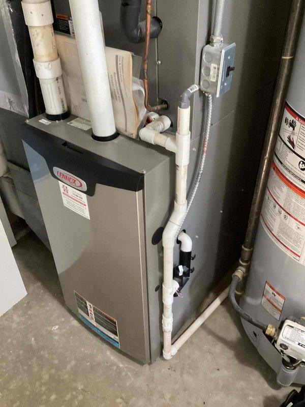 Completed warranty replacement of blower wheel and motor mount on Lennox furnace that was producing a howling noise. Installed and secured new components, then verified proper operation through startup testing including second stage heating cycle. Unit is now operating quietly and providing proper heating function with no abnormal sounds.