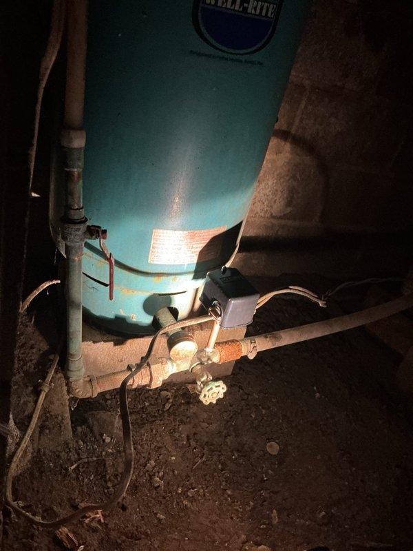 Diagnosed and replaced faulty pressure switch on Well-Rite water pressure tank system that was actively leaking. After installation of new switch, cycled the pump multiple times to verify proper operation and confirm absence of leaks throughout the system.