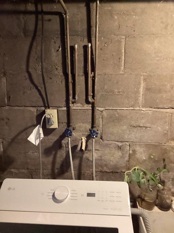 Diagnosed and repaired multiple plumbing issues including leaking boiler drains and pipe connections that were initially misidentified as a washing machine problem. Inspected electric water heater due to customer's report of insufficient hot water, resulting in installation of new water heater and replacement of two faulty boiler drains to resolve the leakage issues.