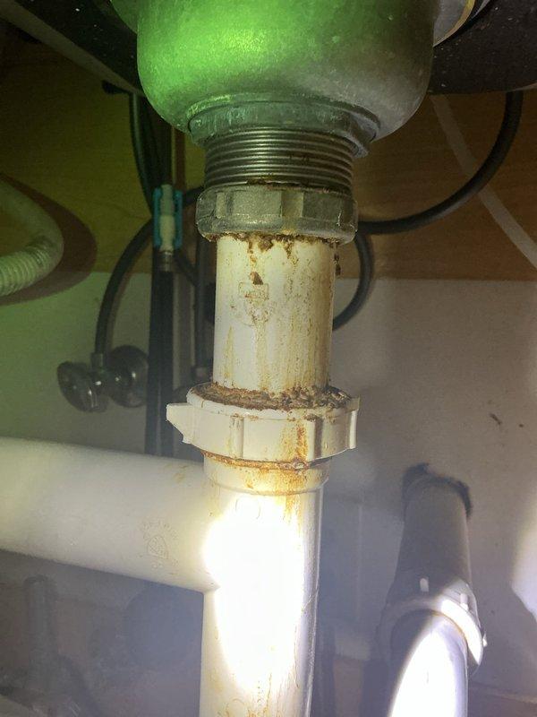 Responded to leak under kitchen sink following a recent garbage disposal installation. Diagnosed and replaced two faulty shut-off valves that were leaking, along with a leaking drain stem. Installed two new stops with water hammer arrestor for dishwasher and a new flanged tailpiece to resolve all leak sources.