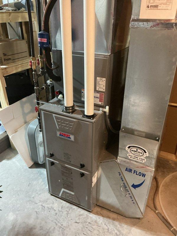 Responded to a service call regarding a reported issue with the airgap device at the customer's kitchen countertop. Upon thorough inspection of the kitchen sink area (which features a stainless steel undermount sink in white marble/quartz countertop), no problems were detected with the airgap device. Documented the kitchen sink configuration and HVAC system with photographs for service records. No repairs were necessary.