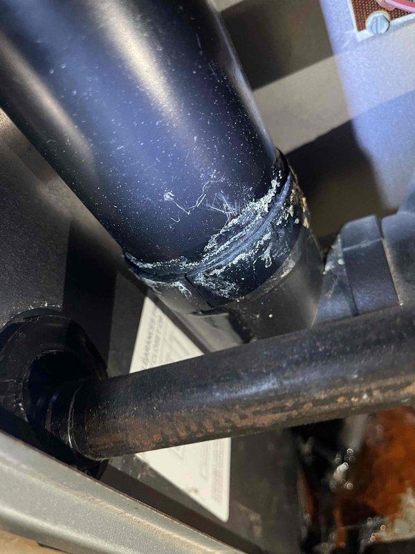Performed routine furnace preventative maintenance inspection and identified a cracked flue collar with active water leakage, which was temporarily sealed with caulk. Inspection also revealed failing blower bearings requiring replacement. Heat exchanger and all other components were verified to be in working condition and operating within specifications.