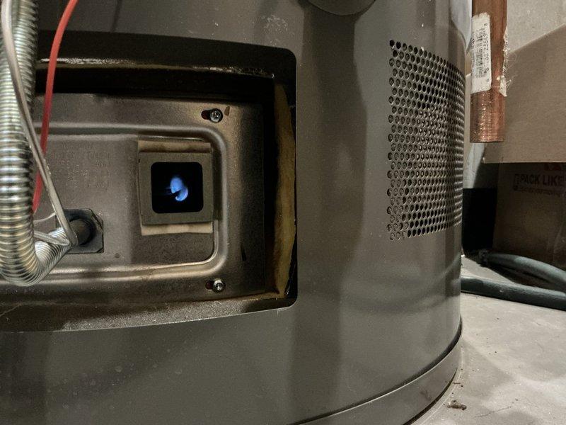 Performed a comprehensive flush on an 80-gallon Richmond gas water heater, running the procedure for approximately 30 minutes to remove sediment buildup and restore optimal efficiency. During service, inspected the burner assembly which showed proper blue flame pattern and no signs of malfunction. Visual inspection confirmed all connections and components were in good working condition with no leaks detected.
