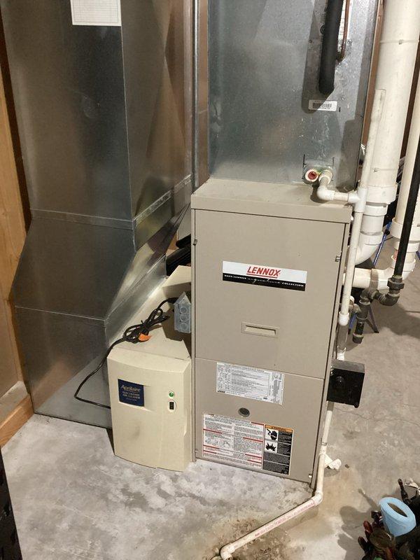 Performed routine furnace tune-up on Lennox FRP system of unknown age. Inspected all components including heat exchanger, electrical connections, condensate lines, and venting with no immediate concerns found. System operated properly during 10-minute test run with appropriate temperatures, however noted inducer motor making abnormal noise and significant burner corrosion; recommended obtaining pricing for inducer replacement.
