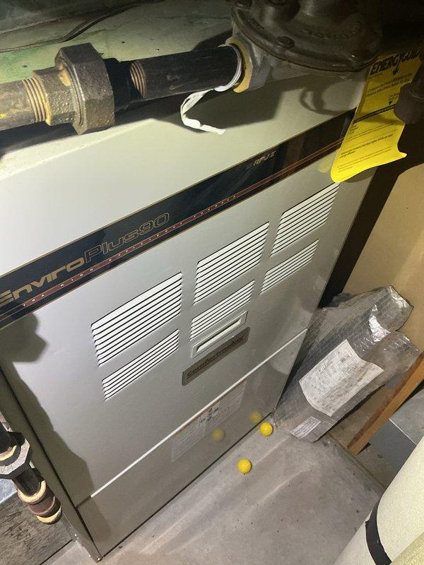 Performed a furnace tune-up on a 26-year-old EnviroPlus heating system that was experiencing high electricity usage. Inspection revealed multiple broken eyelets that had fallen onto the secondary heat exchanger, resulting in dangerously high carbon monoxide levels in the exhaust and excessive amp draw. System was tagged as unsafe and recommendation made for equipment replacement consultation.