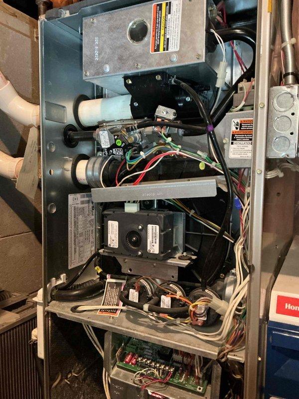 Responded to service call for 18-year-old Carrier AC unit that wouldn't shut off via thermostat. Diagnosed shorted crankcase heater affecting compressor operation, which was verified by removing heater from circuit. Also inspected secondary heat exchanger and noted early signs of moisture intrusion behind the component. Scheduled follow-up with service advisor to address repairs.