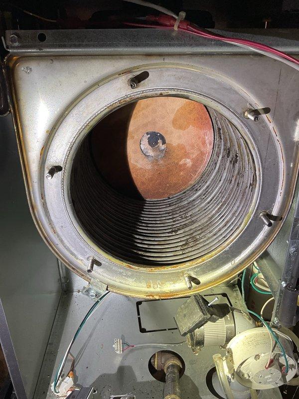 Performed boiler tune-up under maintenance agreement. Cleaned heat exchanger which showed significant buildup of dark residue along the ribbed surfaces. Identified deteriorating back insulation requiring replacement; customer will be provided pricing for this component. Overall unit is in very good condition aside from the insulation issue.
