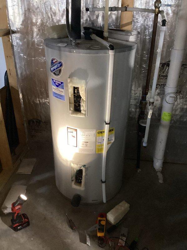 Responded to a service call for a 2022 electric tanked water heater that was not producing hot water after the residence had been vacant for approximately one month. Diagnostic testing identified a faulty bottom heating element as the source of the problem. Replaced the bottom element, restoring proper functionality to the unit.