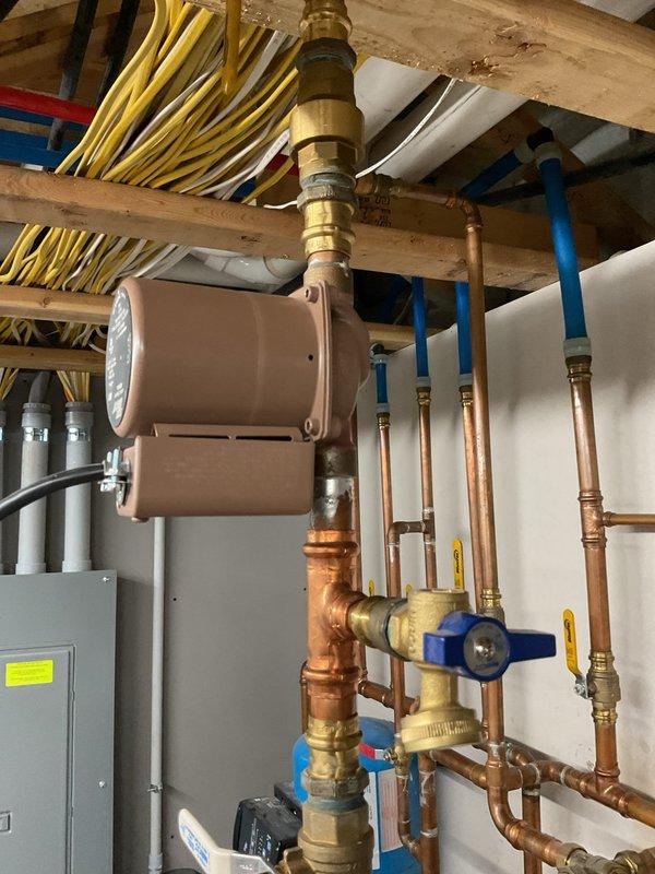 Diagnosed hot water supply issue affecting residential boiler system. Inspection revealed fully operational boiler and adequately heated indirect tank, but only lukewarm water at fixtures. Determined faulty recirculation pump, failed check valve, and malfunctioning mixing valve were preventing proper hot water distribution; recommended replacement of all three components to restore proper system functionality.