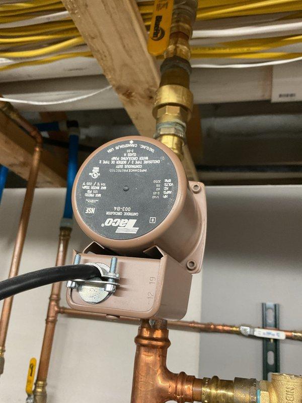 Diagnosed hot water supply issue affecting residential boiler system. Inspection revealed fully operational boiler and adequately heated indirect tank, but only lukewarm water at fixtures. Determined faulty recirculation pump, failed check valve, and malfunctioning mixing valve were preventing proper hot water distribution; recommended replacement of all three components to restore proper system functionality.