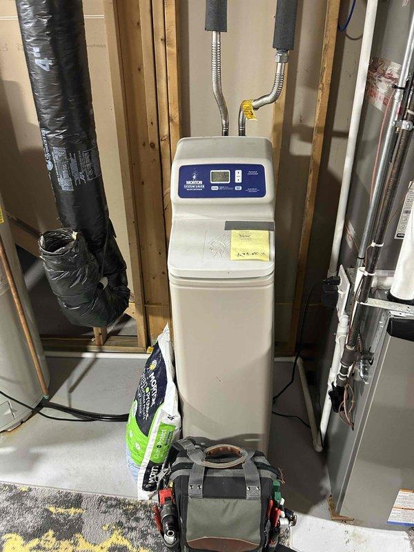 Completed annual furnace tune-up on 1-year-old system, clearing accumulated debris from condensate drain line and trap. Verified proper operation of all critical components including inducer motor, pressure switch, control board connections and thermostat functionality, with combustion CO at 18 ppm. System is operating within normal parameters with no immediate concerns requiring attention.
