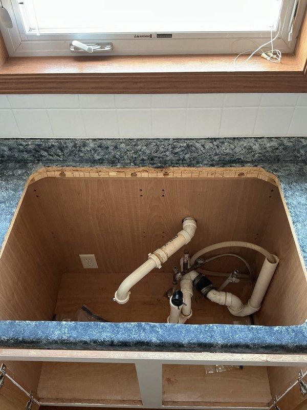 Completed installation of customer-supplied kitchen faucet, sink, and reconnection of existing garbage disposal. Prepared plumbing connections, secured all components, and verified system for proper operation and absence of leaks. All work was completed according to specifications with standard P-trap configuration and proper connections to existing drain system.
