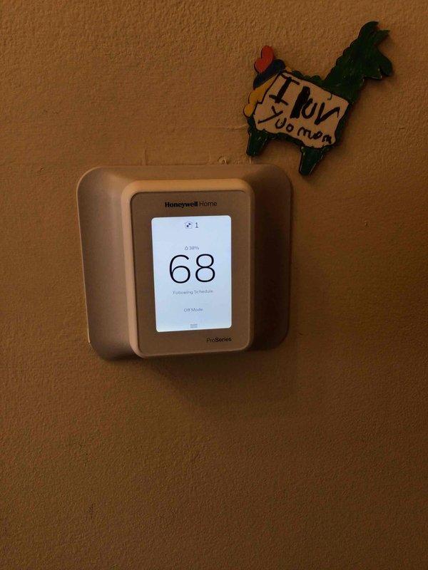 Responded to service call for unresponsive thermostat with blank display. Upon inspection, determined furnace disconnect switch was in OFF position, not a thermostat malfunction. Restored power to system, verified proper operation of Honeywell ProSeries thermostat and heating functionality.
