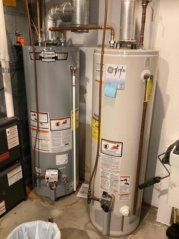 Responded to service call for two plumbing issues: outdoor spigot with dripping shut-off valve and upstairs shower experiencing temperature fluctuations. Diagnosed Kohler cartridge failure in shower; tightened packing nut as temporary measure and assisted customer with ordering replacement cartridge. Inspected water heater system and documented existing valve configuration with photographs.
