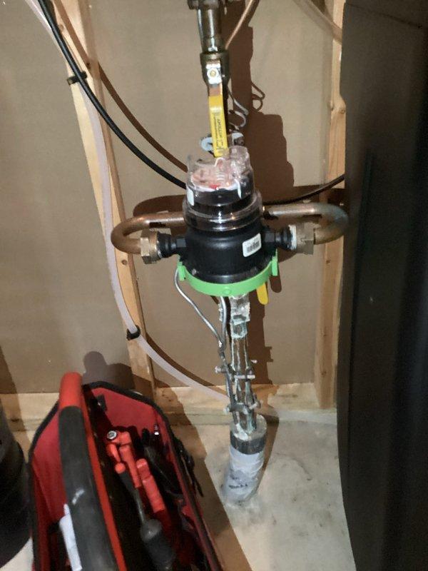 Performed complimentary new customer plumbing inspection, focusing on a 13-year-old water heater that customer reported has never been flushed. Inspected existing water treatment system (Doctor's brand water softener with digital control head) and examined plumbing connections including valve assembly with copper piping. Discussed customer's concerns about elevated water bills potentially related to outdoor spigot issues and provided recommendations for water heater maintenance.