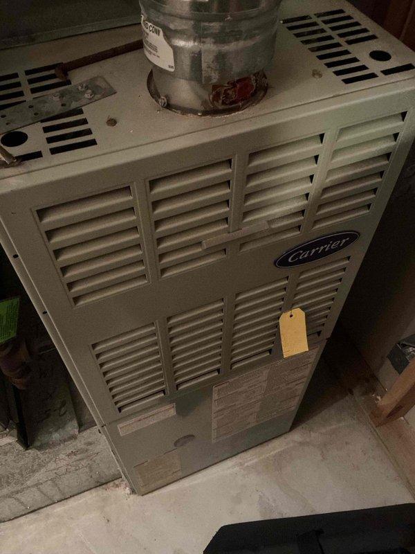 Performed scheduled maintenance on 15-year-old Carrier natural gas furnace, which had not been serviced in approximately 5 years. Inspection revealed worn components requiring attention; completed motor replacement, blower cleaning, and full system replacement to restore optimal functionality.