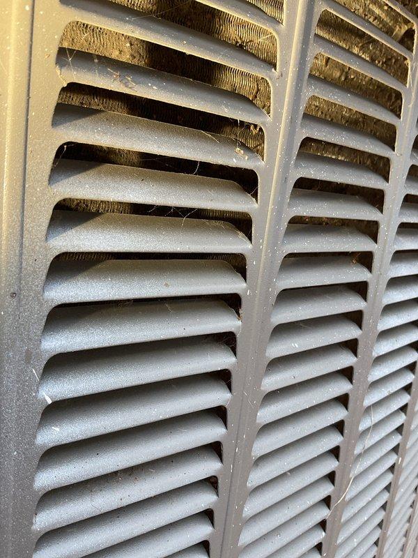 Responded to service call for heat pump not running with error code 408. Diagnosed system with a plugged condenser and found compressor not operating while fan was running. System was operating on emergency heat mode. Recommended thorough cleaning and testing of outdoor unit in spring and sourcing a proper hood to replace the current makeshift siding cover over the unit.