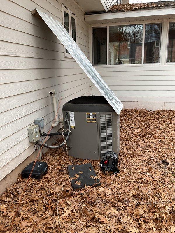 Responded to service call for heat pump not running with error code 408. Diagnosed system with a plugged condenser and found compressor not operating while fan was running. System was operating on emergency heat mode. Recommended thorough cleaning and testing of outdoor unit in spring and sourcing a proper hood to replace the current makeshift siding cover over the unit.
