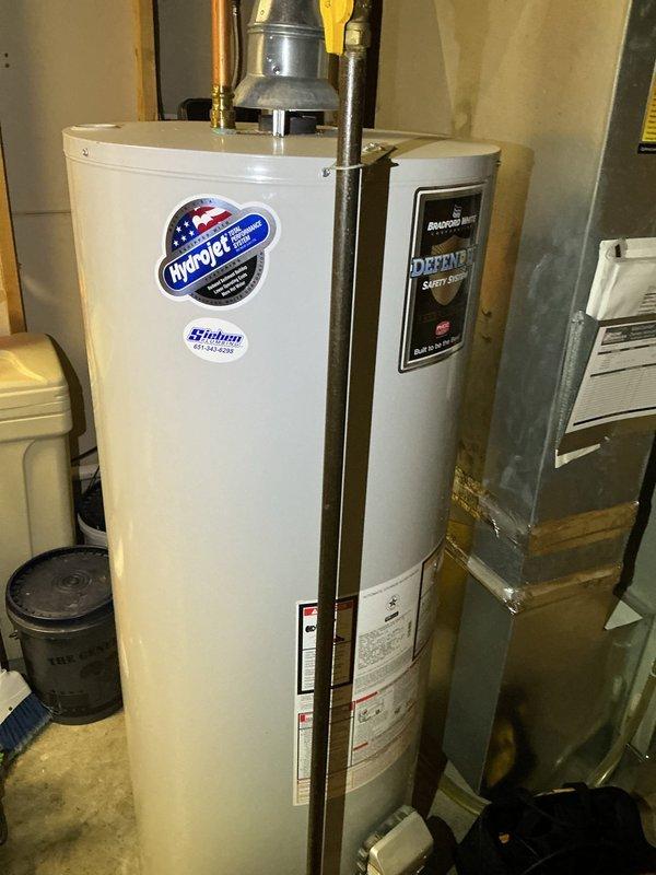 Performed annual maintenance on 13-year-old Trane furnace. Identified crack forming inside high limit switch, documented with photos of water heater system and electrical connections. Recommended heat exchanger replacement and scheduled follow-up with comfort advisor to discuss replacement options.