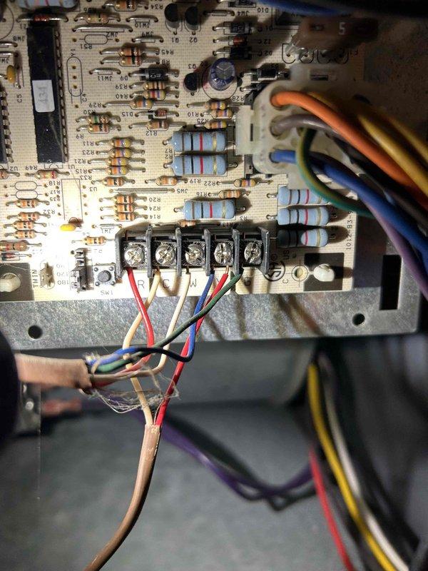 Diagnosed and repaired no heat condition on aging furnace by clearing corrosion buildup in pressure switch tube port and inducer motor. System was recycling repeatedly due to blocked pressure switch; removed obstruction and restored proper operation, though noted potential for future buildup recurrence.