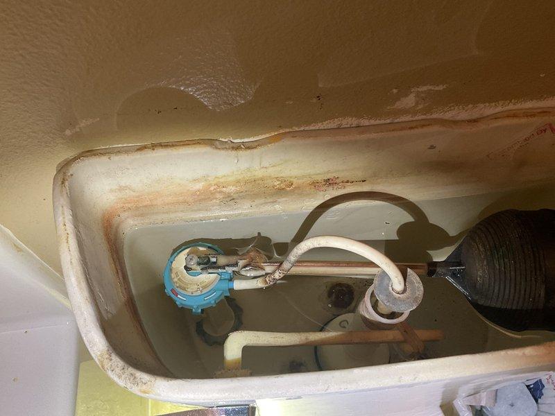 Conducted annual plumbing inspection and identified several issues requiring attention. Water pressure tested at approximately 100-120 PSI, exceeding recommended levels. Interior toilet tank inspection revealed significant mineral deposits, aging components, and a deteriorating fill valve requiring replacement. Provided estimates for recommended repairs including toilet fill valve replacement, bathroom sink stops, and water heater replacement.