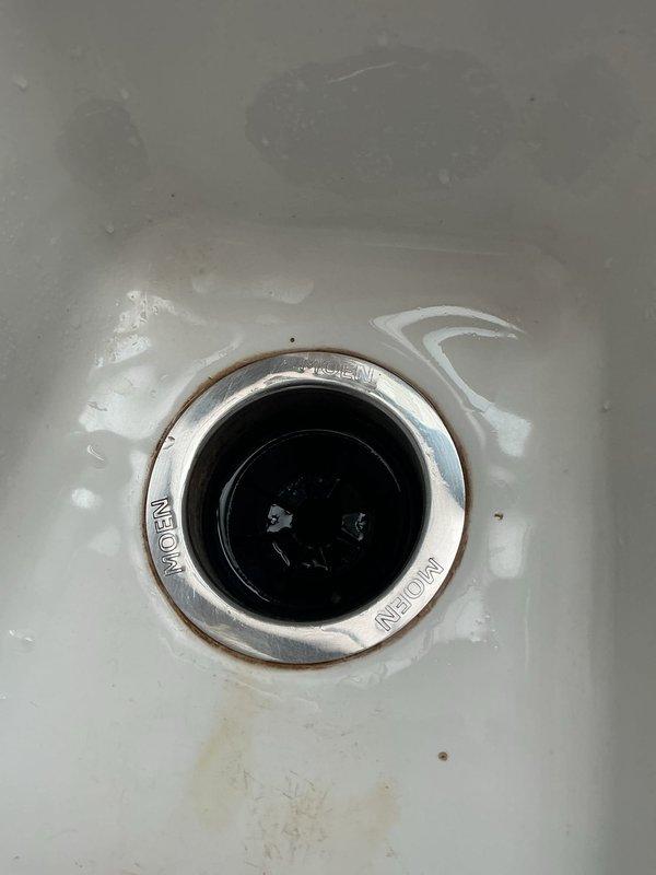Completed estimate for installation of customer-supplied sink, drain, MOEN faucet, and garbage disposal in kitchen. Assessed existing double-basin kitchen sink setup with current brushed nickel/stainless steel faucet for replacement. Customer informed of COD payment terms if they decide to proceed with the proposed work.