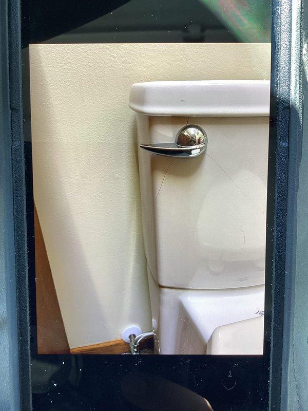 Responded to emergency call for active water leak in basement. Upon inspection, identified a cracked toilet tank as the source of the leak which was allowing water to penetrate through to the basement ceiling. Replaced the damaged toilet to resolve the issue and prevent further water damage.