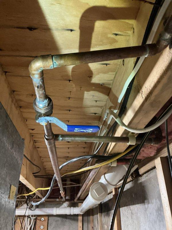 Responded to low water pressure complaint in master bath. Discovered and cleaned minor blockage in shower head restrictor, restoring normal flow. During inspection, identified three freeze breaks in basement hose bib line. Replaced several feet of half-inch pipe to repair damage and restore proper water pressure throughout the system.