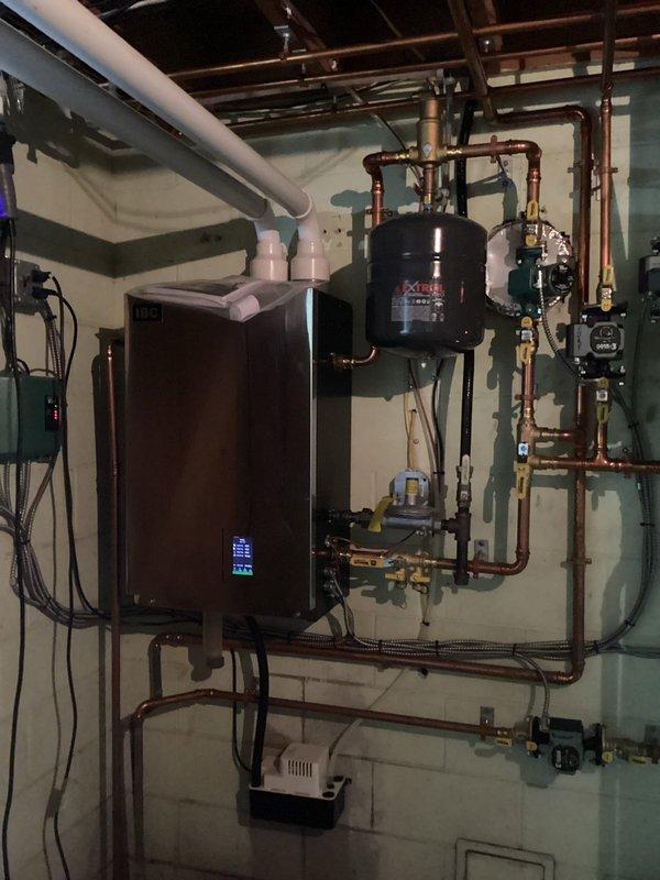 Performed annual maintenance on residential heating system, which included cleaning the flame sensor on the FRP boiler (installed 2 years ago), verifying proper operation of all heating zones, and inspecting the heat exchanger which appeared in good condition. Drained and cleaned the condensate trap, checked system pressure, and confirmed all components were functioning correctly. Visual inspection of the comprehensive copper piping network, expansion tank, and associated valves showed the installation to be in good working order.