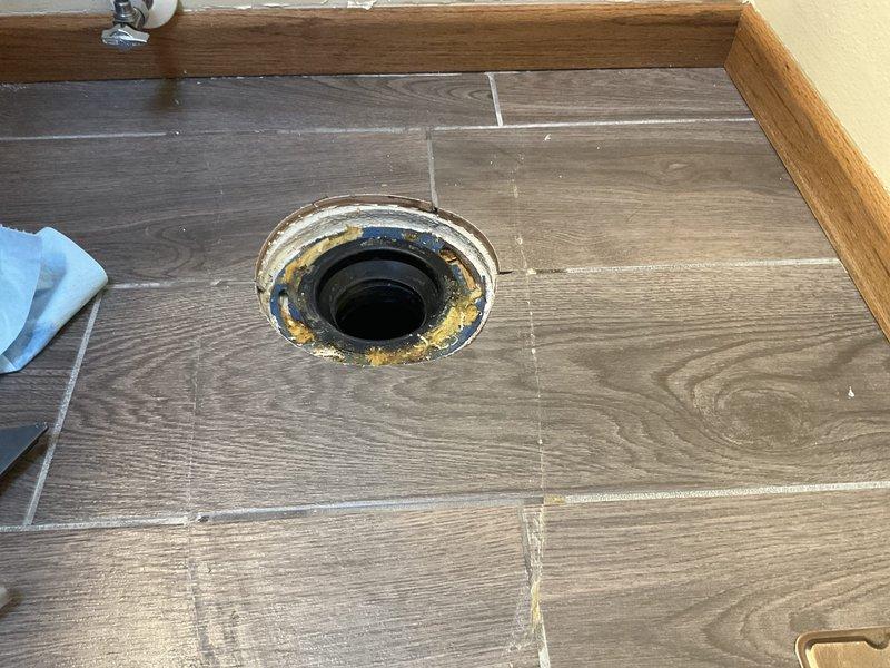 Replaced cracked American Standard toilet tank with new Gerber Viper ADA-compliant toilet and seat. The upgraded model features an elongated bowl for improved comfort, sanitary bar to prevent liquid intrusion under tank, and is designed to handle chemically-treated water while using 50% less water than the previous unit.