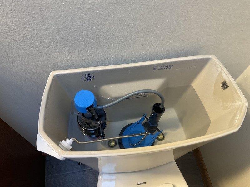 Replaced cracked American Standard toilet tank with new Gerber Viper ADA-compliant toilet and seat. The upgraded model features an elongated bowl for improved comfort, sanitary bar to prevent liquid intrusion under tank, and is designed to handle chemically-treated water while using 50% less water than the previous unit.