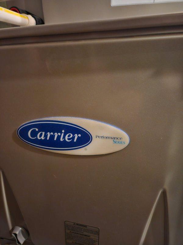 Performed furnace tune-up on Carrier Performance Series unit, including cleaning flame sensor and flushing condensate trap. Inspected heat exchanger with no issues found. Adjusted humidifier settings which resolved customer's concern about functionality; system now operating properly.