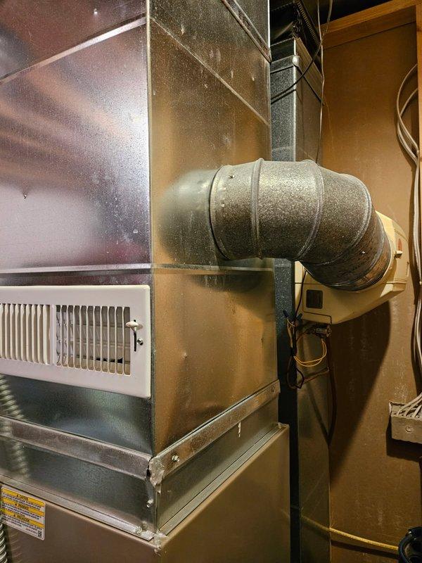 Performed furnace tune-up on Carrier Performance Series unit, including cleaning flame sensor and flushing condensate trap. Inspected heat exchanger with no issues found. Adjusted humidifier settings which resolved customer's concern about functionality; system now operating properly.