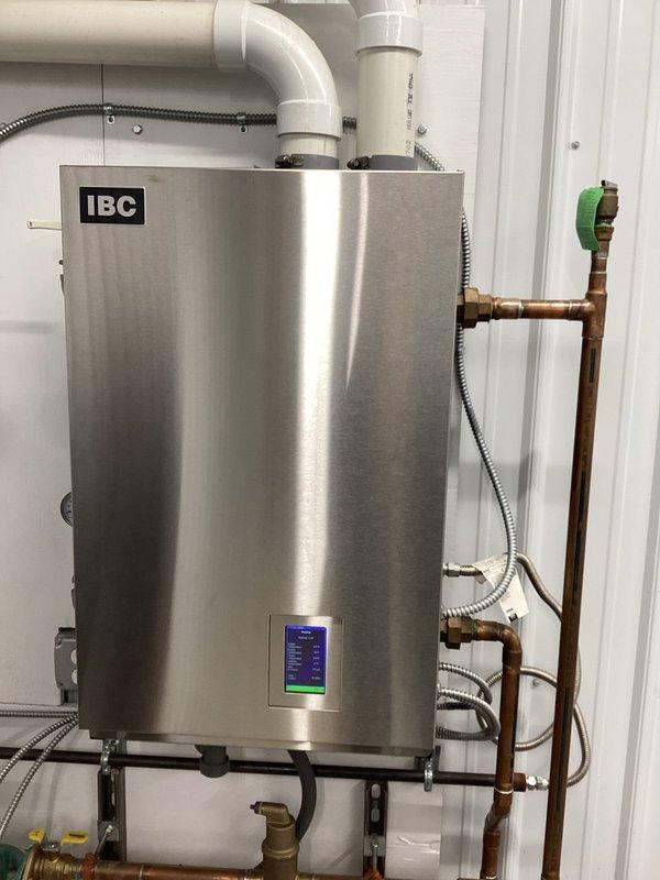 Investigated error code on IBC gas boiler providing in-floor heat in shed. Upon inspection, found no saved error codes in system log, indicating it was likely a temporary issue. Discovered mouse infestation inside unit, removed rodent, and thoroughly cleaned equipment to restore proper operation.