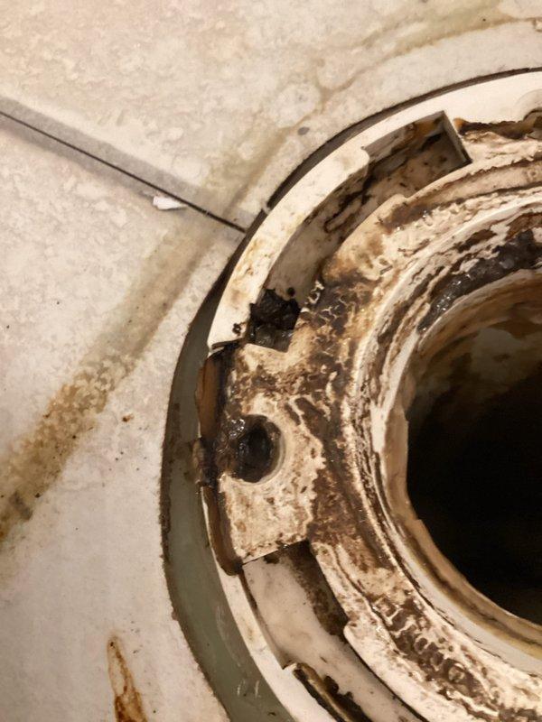 Responded to service call for toilet leakage issue identified during home inspection. Upon assessment, discovered deteriorated toilet flange with significant water damage to surrounding tile. Removed toilet, replaced broken flange, installed new wax ring, and reset toilet properly to eliminate leak and restore proper functionality.