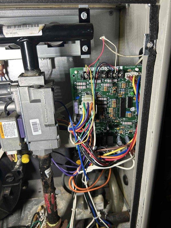 Diagnosed intermittent heating issue on older furnace that was cycling improperly. Upon inspection, identified faulty control board connection when manipulating the Molex plug caused flame cutout and pressure switch code. Replaced control board, reconnected all wiring properly, and performed complete system testing to verify proper operation. Unit now functioning correctly with stable flame and normal operation.