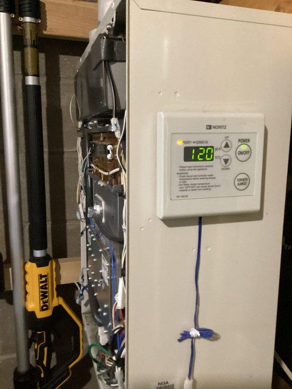 Performed diagnostic assessment on Noritz tankless water heater system after customer reported high CO levels previously detected by Centerpoint technician. Inspected combustion chamber, venting system, and control panel displaying "120". Confirmed elevated CO2 readings indicating potential airflow or combustion issue, but system currently operating within acceptable parameters. Will monitor system performance and recommend follow-up if conditions change.