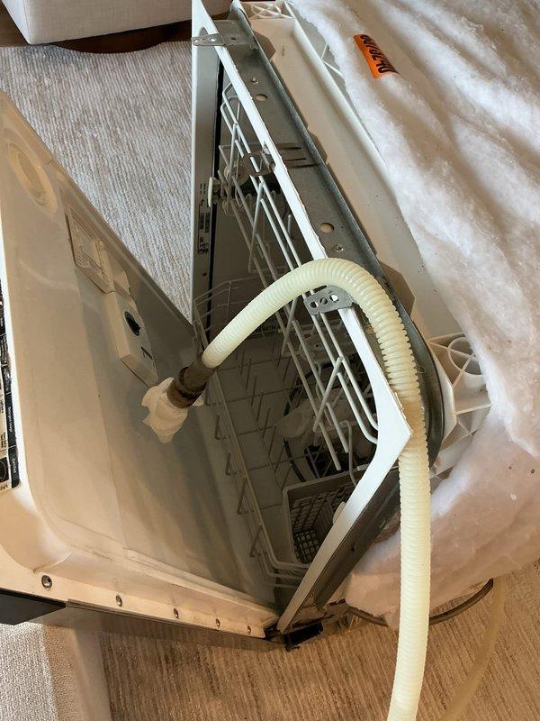 Replaced non-functional dishwasher shut-off valve located under the sink and completed installation of customer-supplied dishwasher. Connected water supply line with new shut-off, secured drain hose, and performed leak check to verify proper operation and drainage.